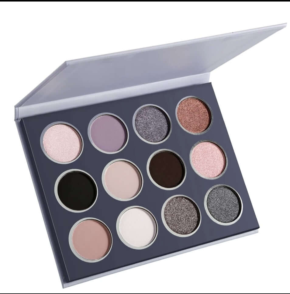 Bold and Luscious Cosmetics Silver Moon Palette from the side shos the differences in the black, light grey and pewter color eye shadow pans in the eye palette.  Make a smokey eye with this palette.