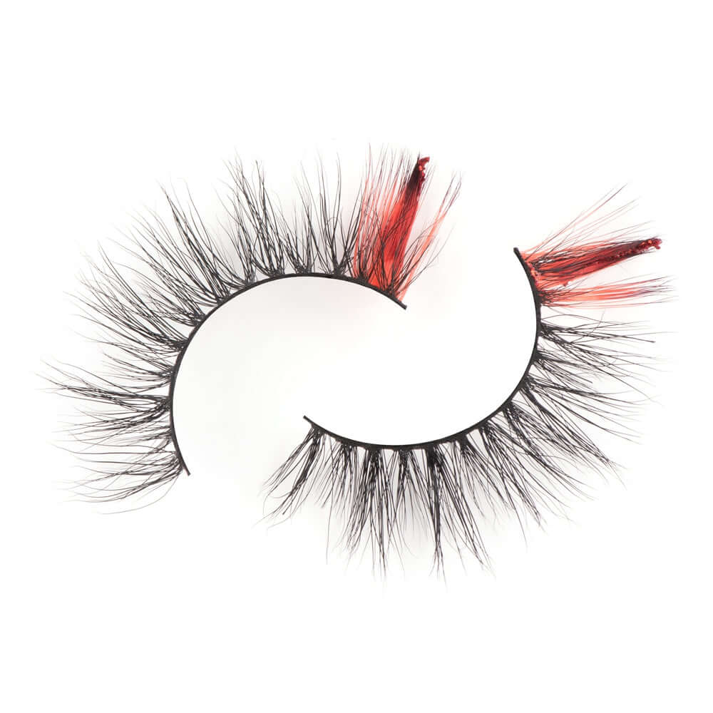 From the top, on a white background you can see the outer edge red lashes on Bold and Luscious Color Splash Lashes in style Flamenco.