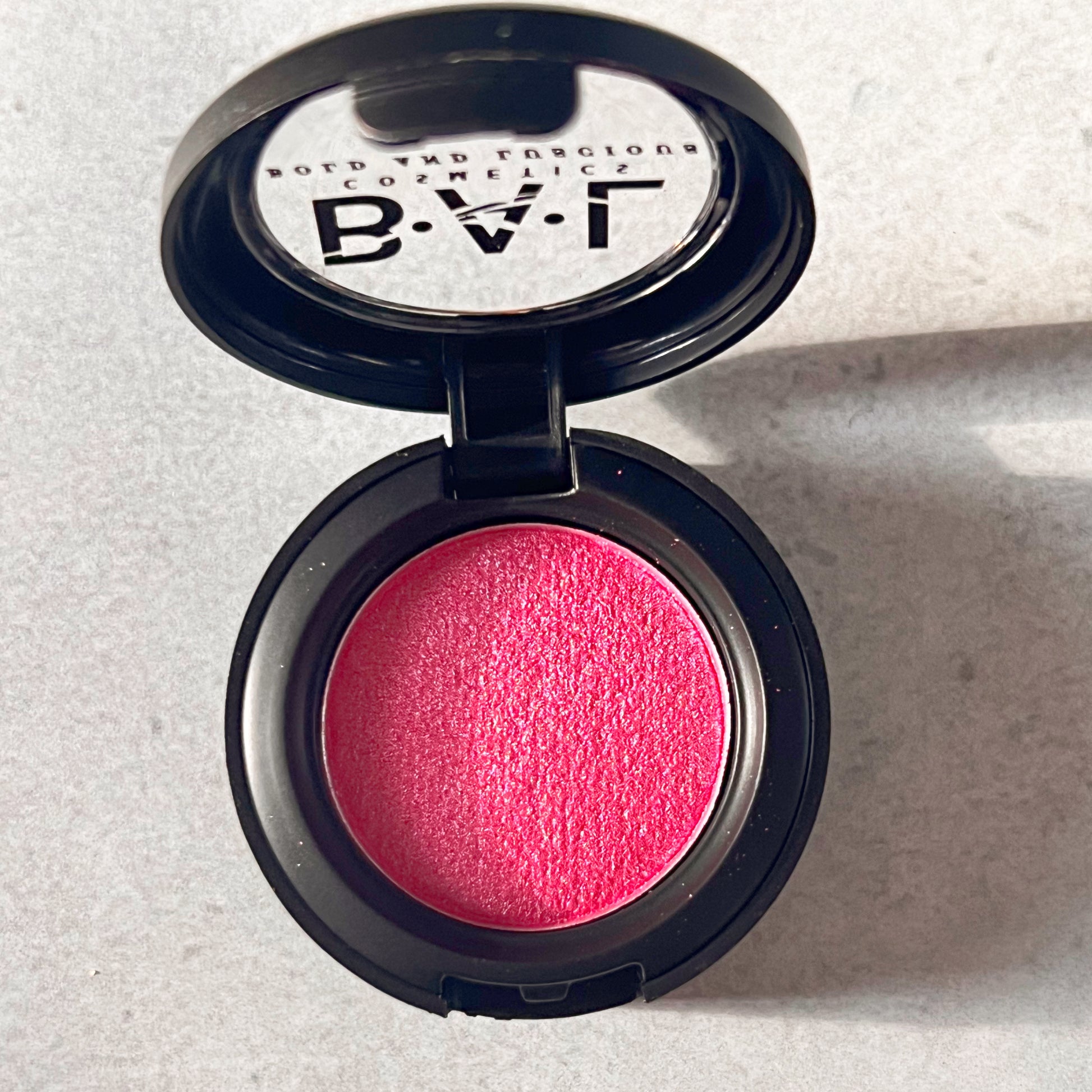 A single Pan Eye shadow that is a shimmery red.