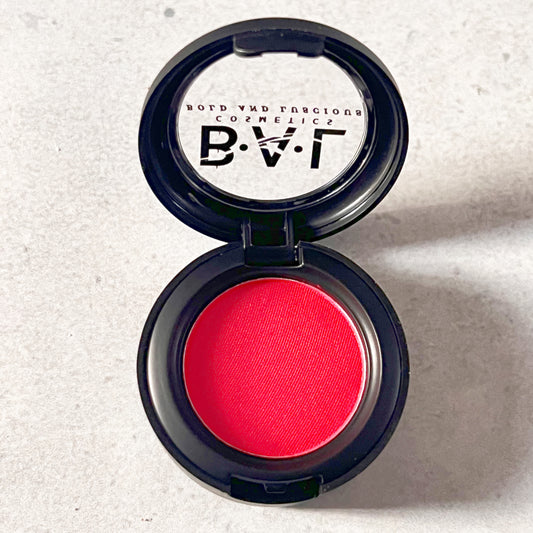 A vibrant shimmery red color in a single pan  by Bold and Luscious Cosmetics.