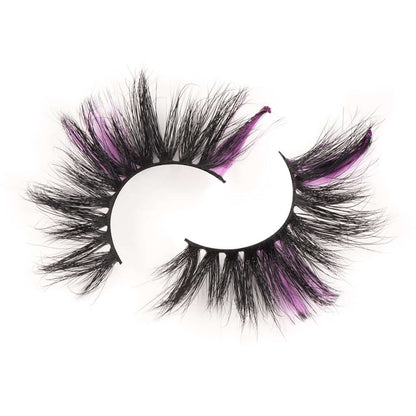 Bold and Luscious Cosmetics color splash lashes in style Misha on a white background that showcases the alternating black and purple color and shows the detail in the style of lashes.
