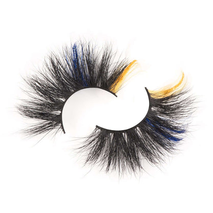 From the top and on a white background, bold and luscious cosmetics color splash lash collection in style samba shows the yellow on the end and the subtle blue  closer to the middle of the eyelash.